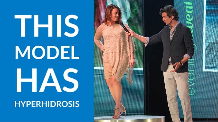 model with hyperhidrosis on stage with Adam Glassman from O, The Oprah Magazine