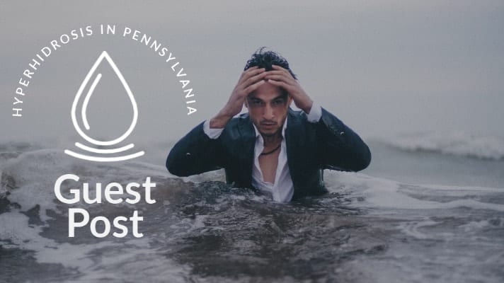 man in suit standing in ocean